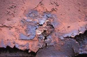 A base coat of red oxide primer helps to prevent rust formation on ferrous metals.